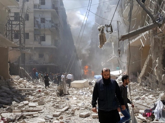 Syrians at the site of airstrikes in the rebel-held neighbourhood of Bustan Al Qasr in Aleppo, Syria, 28 April 2016. At least 34 people were killed by shelling and missile fire in the Syrian city of Aleppo, the largest in the north of the country, the Syrian Observatory for Human Rights, or SOHR, reported on 28 April. Among those were at least 20 people killed by the airstrikes of warplanes, the identity of which is still unknown, in the neighborhoods of Bustan al-Qasr and al-Kalasa, according to SOHR.