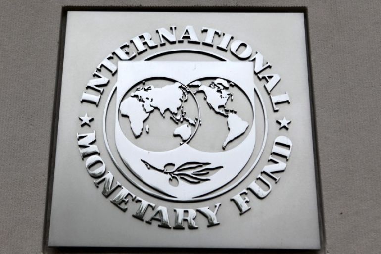 The International Monetary Fund (IMF) logo is seen at the IMF headquarters building in Washington, in this April 18, 2013 file photo. The IMF is expected to issue its semi-annual world economic outlook this week. REUTERS/Yuri Gripas/Files GLOBAL BUSINESS WEEK AHEAD PACKAGE - SEARCH "BUSINESS WEEK AHEAD JANUARY 18" FOR ALL IMAGES