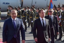 Russian Prime Minister Dmitry Medvedev and Armenian Prime Minister Hovik Abrahamyan, left foreground, review honor guard during a welcome ceremony on Medvedev's arrival in Yerevan, Armenia, Thursday, April 7, 2016. (Alexander Astafyev/Sputnik, Government Pool Photo via AP)