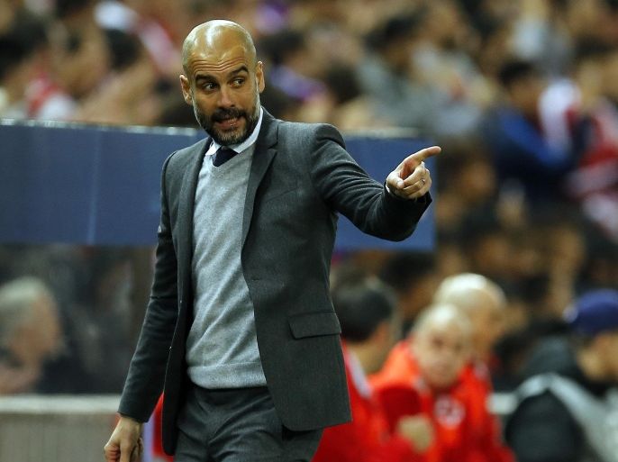Bayern head coach Pep Guardiola gestures during the Champions League 1st leg semifinal soccer match between Atletico Madrid and Bayern Munich at the Vicente Calderon stadium in Madrid, Spain, Wednesday, April 27, 2016. (AP Photo/Paul White)