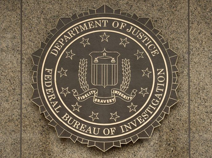 (FILE) The logo of the Federal Bureau of Investigation (FBI) at the J. Edgar Hoover FBI Building in Washington DC, USA, 22 December 2014. Apple chief executive Tim Cook refused the judge's order in an open letter posted on the company's website 16 February 2016 shortly after Judge Sheri Pym ordered the company to help the FBI access data they believe is stored on the phone. The December 2 attack in San Bernardino was carried out by Syed Rizwan Farook and his wife, Tashfeen Malik, at a holiday party at the county office where Farook worked. Fourteen people were killed. Police killed Farook and Malik later that same day in a shoot-out. The FBI wants Apple to help it hack into Farook's iPhone by building a new version of the iOS software that would circumvent security features and install the software on the iPhone, which was recovered during the investigation.