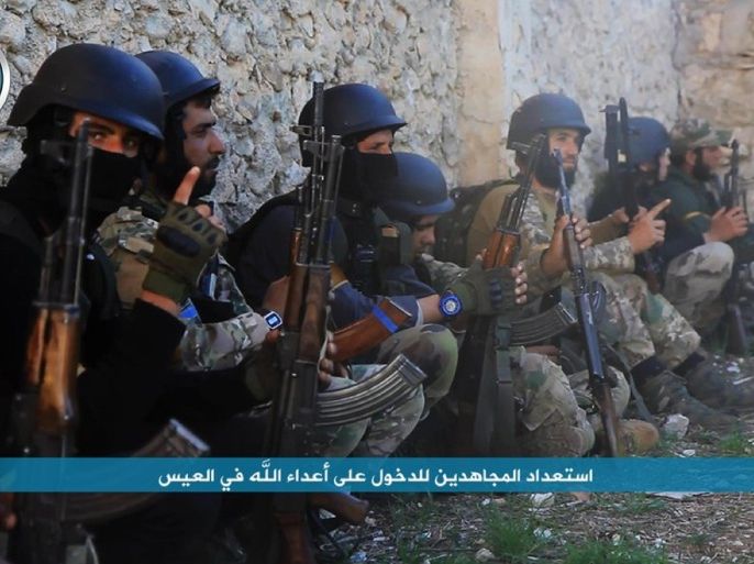 In this image posted on the Twitter page of Syria's al-Qaida-linked Nusra Front on Friday, April 1, 2016, shows fighters from al-Qaida's branch in Syria, the Nusra Front, getting ready to attack the northern village of al-Ais in Aleppo province, Syria. The Britain-based Syrian Observatory for Human Rights says 12 Hezbollah fighters were killed and dozens were wounded in Saturday's attack by militants led by al-Qaida's Syria branch — known as the Nusra Front — on the northern village of al-Ais. The title in Arabic that reads "holy warriors getting ready to attack the enemies of God in al-Ais." (Al-Nusra Front via AP)