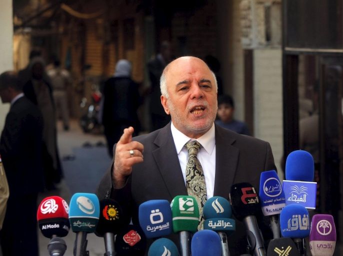 Iraqi Prime Minister Haider al-Abadi speaks at a news conference during his visit to Najaf, south of Baghdad, in this file photo taken October 20, 2014. The U.S. and Iran have formed an unlikely tacit alliance behind Iraq's prime minister as he challenges the ruling elite with plans for a non-political cabinet to fight corruption undermining the OPEC nation's economic and political stability. Local calls for Haider al-Abadi's removal -- including one by his predecessor as prime minister al-Maliki -- had been growing as he pursued a reshuffle aimed at addressing graft, which became a major issue after oil prices collapsed in 2014 and strained the government's finances as it launched a costly campaign against Islamic State. REUTERS/Alaa Al-Marjani /Files TPX IMAGES OF THE DAY