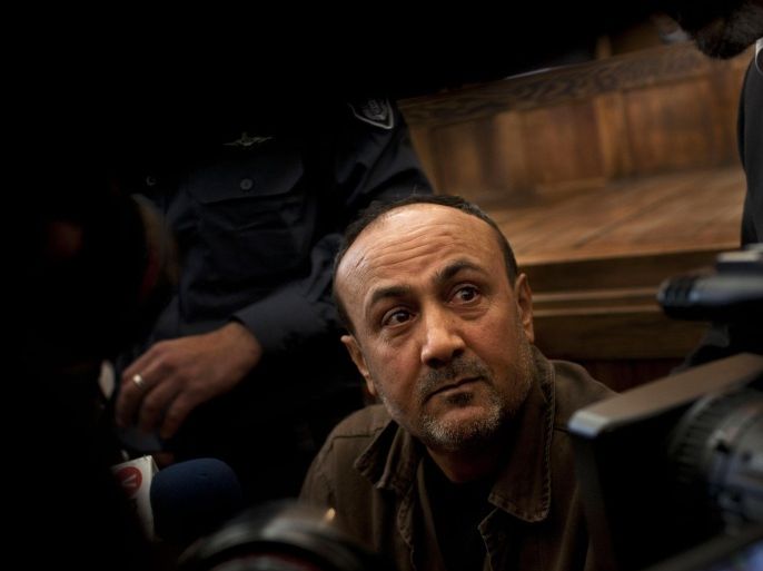FILE - In this Jan. 25, 2012 file photo, jailed Senior Fatah leader Marwan Barghouti appears in a Jerusalem court. New rumors about Mahmoud Abbas¹ purported health problems have drawn attention to the lack of a designated successor or orderly method for choosing one. Aides to the 80-year-old Palestinian leader have dismissed the rumors as baseless, but behind the scenes the battle for succession is intensifying. (AP Photo/Bernat Armangue, File)