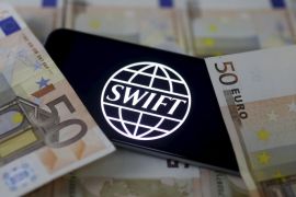 Swift code bank logo is displayed on an iPhone 6s on top of Euro banknotes in this picture illustration made in Zenica, Bosnia and Herzegovina, January 26, 2016. REUTERS/Dado Ruvic/File Photo TPX IMAGES OF THE DAY