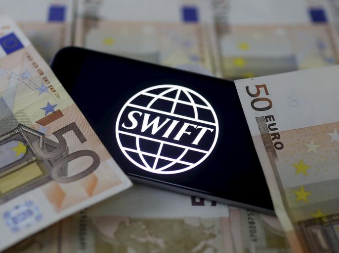 Swift code bank logo is displayed on an iPhone 6s on top of Euro banknotes in this picture illustration made in Zenica, Bosnia and Herzegovina, January 26, 2016. REUTERS/Dado Ruvic/File Photo TPX IMAGES OF THE DAY