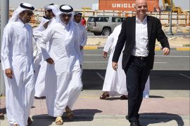 epa05271668 FIFA President Gianni Infantino (R) arrive to the joint press conference for FIFA, Supreme Committee for Delivery and Legacy, and Qatar Football Association in Doha, Qatar, 22 April 2016. Gianni Infantino is on a two-day official visit to Qatar. EPA