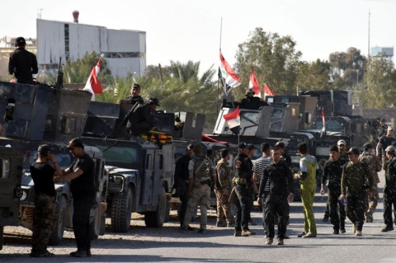 A picture made available on 19 March 2016, shows Iraqi military vehicles and troops advancing towards the centre of Al Muhammadi district, west of Ramadi city, western Iraq, 18 March 2016. Iraqi forces said on 09 February 2016, they had recaptured the Al Muhammadi zone near Heet city, west of Ramadi city although some fighting continues near Kubaisa city near the Iraqi borders with Jordan. The Iraqi government announced the 'liberation' of Ramadi from Islamic State, marking the first major setback for the al-Qaeda breakaway group since April 2015.