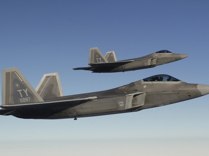 Two F-22 Raptor fighter jets approach a refuelling aircraft as they fly towards the newly established NATO airbase of Aemari, Estonia, in this file photo taken September 4, 2015. The United States flew four F-22 stealth fighter jets over South Korea on Wednesday in a show of force following North Korea's recent rocket launch and ahead of the allies' joint military drills next month aimed at deterring Pyongyang's threat. REUTERS/Wolfgang Rattay/Files