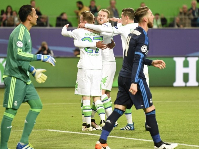Football Soccer - VfL Wolfsburg v Real Madrid - UEFA Champions League Quarter Final First Leg - Volkswagen Arena - 6/4/16 Maximilian Arnold celebrates scoring the second goal for Wolfsburg with team mates Reuters / Fabian Bimmer Livepic EDITORIAL USE ONLY.
