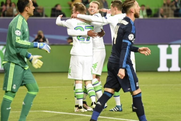 Football Soccer - VfL Wolfsburg v Real Madrid - UEFA Champions League Quarter Final First Leg - Volkswagen Arena - 6/4/16 Maximilian Arnold celebrates scoring the second goal for Wolfsburg with team mates Reuters / Fabian Bimmer Livepic EDITORIAL USE ONLY.