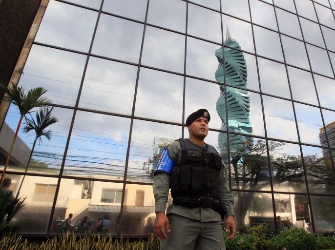 Panamanian Police agents stand guard outside the headquarters of Mossack Fonseca firm, in Panama City, Panama, 12 April 2016. Panama's Prosecutor office raided the headquarters of Mossack Fonseca as part of a regular investigation opened after the Panama Papers leak.