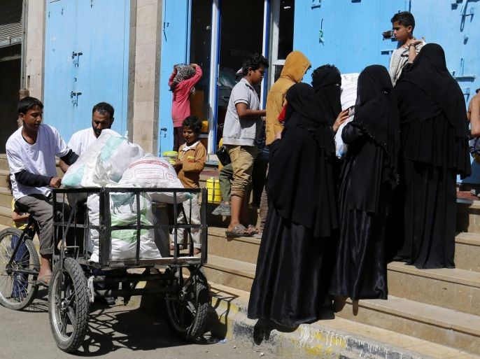 Conflict-affected people wait to receive food aid from a local relief group in Sanaa, Yemen, 04 March 2016. According to UN recent estimates, the nearly year-old conflict in Yemen has left over 21 million people, 80 per cent of the population, in need of humanitarian assistance, including 2.9 million women and girls. Yemen was plunged into violence when the Houthi militia invaded Sana'a, driving the Yemeni government of President Abdo Rabbo Mansour Hadi into exile and triggering foreign military intervention by the Saudi-led coalition to restore Hadis government.