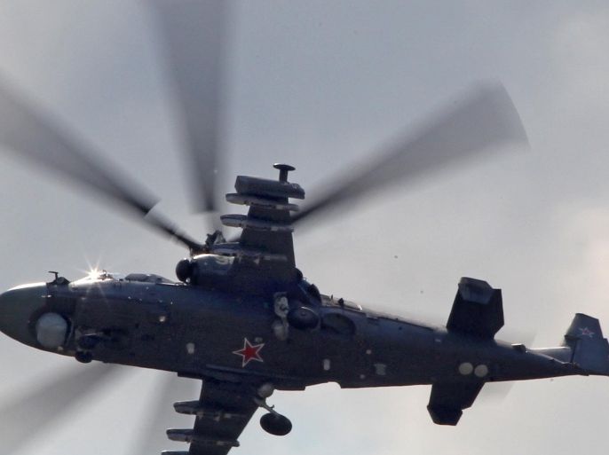 Russian made Ka-52 Alligator attack helicopter in flight during a celebration marking the Russian air force's 100th anniversary in Zhukovsky, outside Moscow, Russia, Sunday, Aug. 12, 2012.
