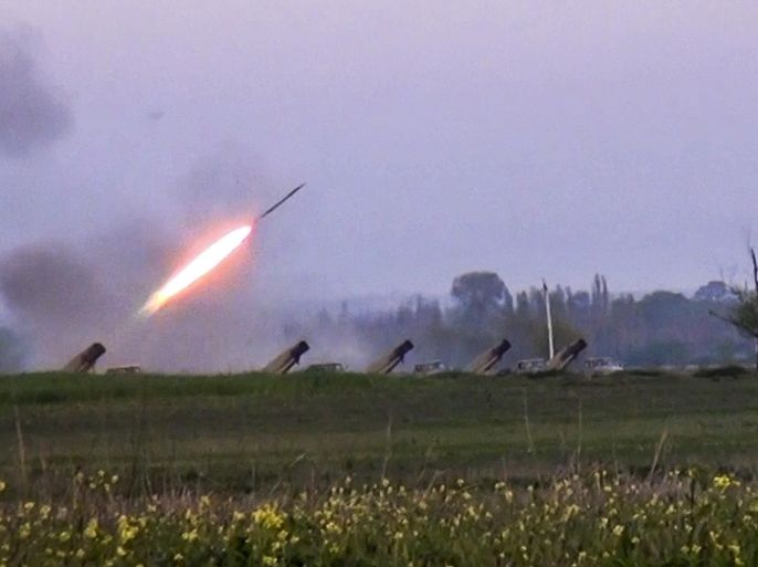 In this image made from video on Sunday, April 3, 2016, a Grad missile is fired by Azerbaijani forces in the village of Gapanli, Azerbaijan. Officials in Azerbaijan and the separatist region of Nagorno-Karabakh say fighting is persisting a day after the worst outburst of hostilities in nearly 20 years killed 30 soldiers. Nagorno-Karabakh, part of Azerbaijan, has been under the control of local ethnic Armenian forces and the Armenian military since a war ended in 1994 with no resolution of the region's status. (AP video via AP)