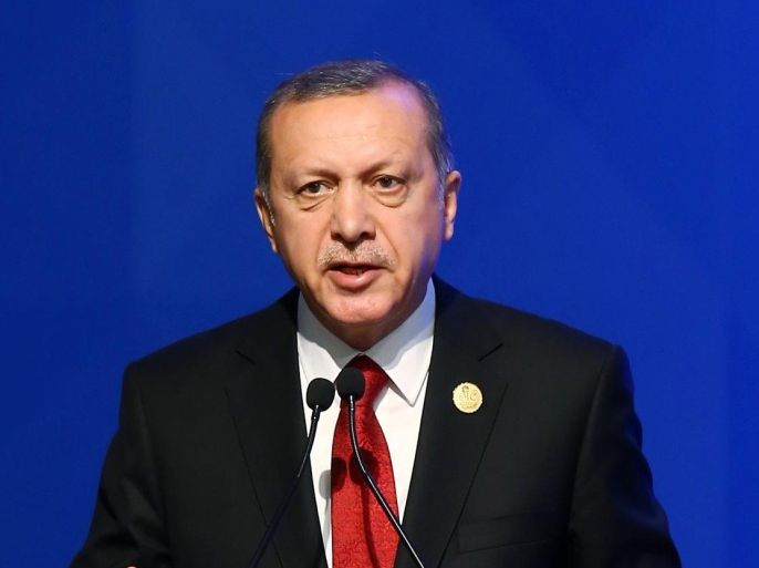 Turkey's President Recep Tayyip Erdogan addresses the leaders and representatives of the Islamic countries during the opening of the 13th Organization of Islamic Cooperation, OIC, Summit in Istanbul, Thursday, April 14, 2016. Turkish President Recep Tayyip Erdogan says Muslim nations have agreed to establish a joint body to fight terrorism and urged the countries’ leaders to examine the root causes of the migration crisis. Addressing the summit of the OIC in Istanbul on Thursday, he stressed terrorism is the largest problem confronting the Muslim world.(Anadolu Agency/Pool Photo via AP)