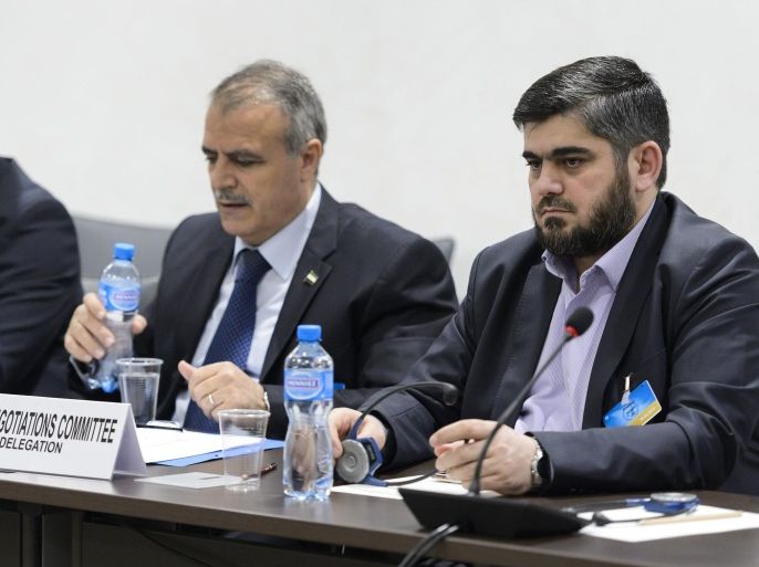 Syrian opposition body (HCN) delegation member George Sabra, delegation head Asaad al-Zoabi and Chief negotiator, Army of Islam rebel group's Mohammed Alloush, from left, attend a meeting on Syria peace talks with UN Syria Envoy at the United Nations office on Friday, April 15, 2016, in Geneva, Switzerland. (Fabrice Coffrini/Pool Photo via AP)