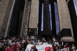 Journalists chant slogans during a protest to mark World Press Freedom Day in front of the Press Syndicate in Cairo, Egypt, Tuesday, May 3, 2016. Memos containing internal instructions from Egypt's Interior Ministry were leaked to the media on Tuesday, outlining strategies on how to deflect public outrage over arrests it made inside the journalists' union, handle the media in general, and deal with the case of an Italian student found tortured to death. Arabic on the banner, bottom, reads, "remove our shackles." (AP Photo/Nariman El-Mofty)