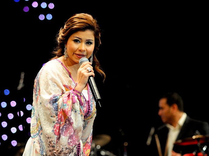 epa01736259 Egyptian singer Sherine Abd El Wahab, wearing a Moroccan kaftan, performing at Nahda stage in the 8th edition of Mawazine festival 'Morocco of cultures' in Rabat, Morocco, 19 May 2009. Sherine Abd El Wahab became popular in the Arab world with her hit 'Ah Ya Lil'. EPA/SELMAOUI-KARIM