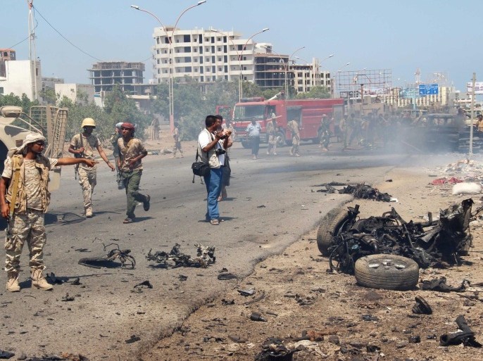 Soldiers gather at the site of a car bomb attack in a central square in the port city of Aden, Yemen, May 1, 2016, that targeted the city's security chief for the second time in a week. REUTERS/Fawaz Salman