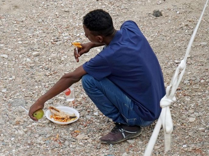 A migrant enjoys his meal on the grounds of the temporary tent city for the reception of migrants set up by the Italian Red Cross in the area of Rome's Tiburtina station in Rome, Italy, 14 June 2015. The Rome chapter of the Red Cross on 12 June urged authorities to create facilities to house the 100 refugees that police cleared out of a makeshift camp near the city's Tiburtina train and bus station the previous evening. Italian cities have been struggling to cope with the huge flow of migrants brought to Sicily after being rescued in the Mediterranean Sea.