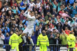 Real Madrid's Portuguese forward Cristiano Ronaldo celebrates after scoring his first goal against Valencia CF during their Spanish Primera Division league match at Santiago Bernabeu's Stadium, in Madrid, Spain, 08 May 2016. Real Madrid won 3-2.