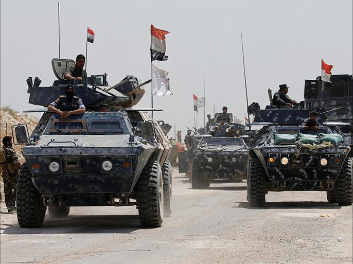 Iraqi federal police advance towards Falluja, Iraq, May 24, 2016. REUTERS/Thaier Al-Sudani