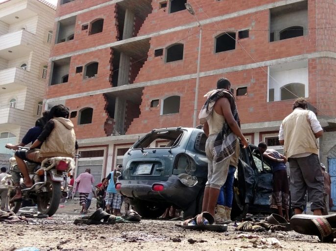 Yemenis inspect the site of a suicide bombing targeting a gathering of young men seeking to join the army in the southern port city of Aden, Yemen, 23 May 2016. According to reports, at least 45 Yemenis were killed in Aden in two suicide bombings targeting an army recruitment center and a group of recruits outside the home of an army commander.