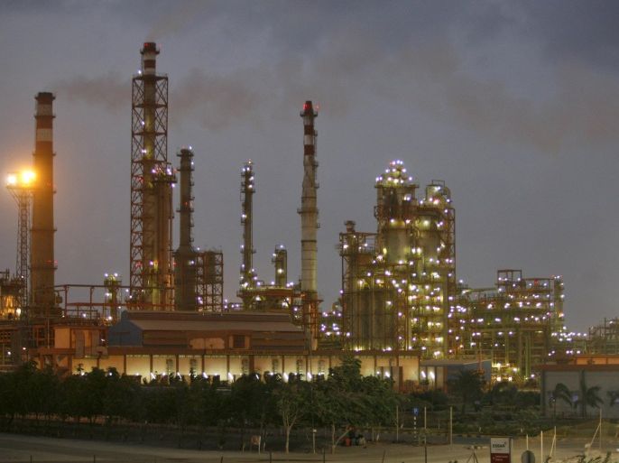 A general view of a refinery at dusk in the western Indian state of Gujarat in this June 5, 2012 file photo. Asia's oil markets are being upended as India's and China's refiners overtake once-dominant buyers like Japan and challenge the United States as the world's biggest consumer. Picture taken June 5, 2012. REUTERS/Amit Dave/Files
