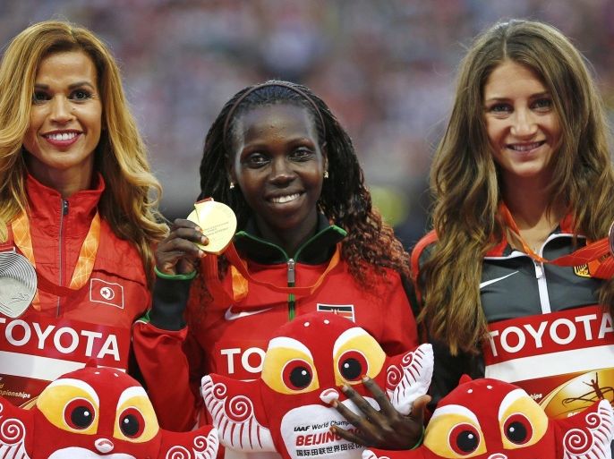 (L-R) Habiba Ghribi of Tunisia, silver medal, Hyvin Kiyeng Jepkemoi of Kenya, gold medal, and Gesa Felicitas Krause of Germany, bronze medal, pose on the podium after the women's 3000 metres steeplechase event during the 15th IAAF World Championships at the National Stadium in Beijing, China, August 27, 2015. REUTERS/Damir Sagolj