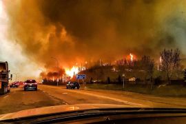 A picture provided by Twitter user @jeromegarot on 05 May 2016 shows a wildfire raging through the town of Fort McMurray, Canada, 03 May 2016. Weather conditions were making it more difficult to extinguish a forest fire that has forced the evacuation of some 70,000 people from the northwestern Canadian city of Fort McMurray. Alberta provincial authorities estimated that at least some 1,600 buildings in the city have been consumed by the flames, which have not caused any