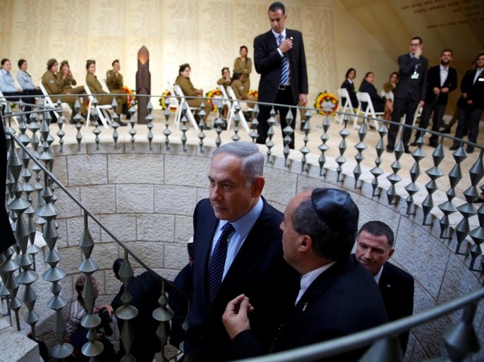 Israel's Prime Minister Benjamin Netanyahu (C) arrives to a monument engraved with names of fallen Israeli soldiers, before the start of a ceremony marking Memorial Day in Jerusalem, May 10, 2016. Israel commemorates its fallen soldiers on Memorial Day, which begins Tuesday night. REUTERS/Ronen Zvulun
