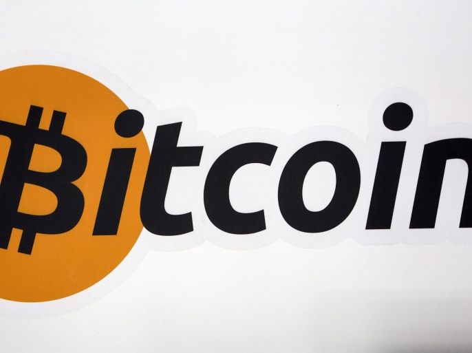A Bitcoin logo is displayed at the Bitcoin Center New York City in New York's financial district July 28, 2015. REUTERS/Brendan McDermid/File Photo
