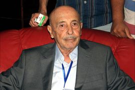 epa04341540 A picture made available on 05 August 2014 shows the newly elected speaker of the Libyan House of Representatives Akila Saleh Issa (C), Tobruk, Libya, 04 August 2014. Amid the escalating conflict across the country the Islamist dominated Libyan General National Congress (GNC) has handed over power to the Libyan House of Representatives, which held its first meeting 02 August, began the process of swearing in its members and elected its new speaker early 05 August, according to local media. EPA