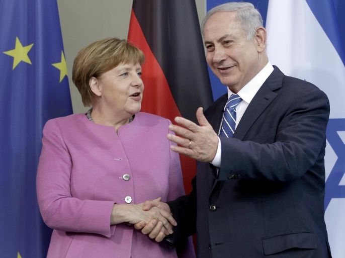 German Chancellor Angela Merkel, left, and the Prime Minister of Israel Benjamin Netanyahu, right, shake hands after a joint news conference as part of a one day governmental meeting at the chancellery in Berlin, Germany, Tuesday, Feb. 16, 2016. (AP Photo/Michael Sohn)