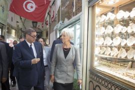 International Monetary Fund (IMF) Managing Director Christine Lagarde (R) walks with Tunisiaâ€™s Prime Minister Habib Essid (L) through a souk after their lunch in Tunis, Tunisia September 8, 2015. REUTERS/Stephen Jaffe/IMF Staff/Handout via Reuters ATTENTION EDITORS - THIS PICTURE WAS PROVIDED BY A THIRD PARTY. REUTERS IS UNABLE TO INDEPENDENTLY VERIFY THE AUTHENTICITY, CONTENT, LOCATION OR DATE OF THIS IMAGE. FOR EDITORIAL USE ONLY. NOT FOR SALE FOR MARKETING OR ADVERTISING CAMPAIGNS. THIS PICTURE IS DISTRIBUTED EXACTLY AS RECEIVED BY REUTERS, AS A SERVICE TO CLIENTS.
