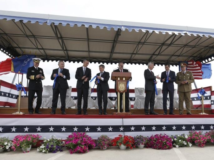 Officials applaud after cutting the blue ribbon during the official inauguration ceremony held at Aegis Ashore Missile Defense System (AAMDS), a military anti-ballistic missile defense facility at Deveselu, 180 Km south from Bucharest, Romania, 12 May 2016. High ranked Romanian officials and representatives of the US Departments of Defense and State, the US Navy's European headquarters and NATO decision makers joined the event. Construction of Aegis Ashore Missile Defense System Complex was started in 2013, in order to support the European Phase Adaptive Approach Phase II (EPAA) missile defence base, the cost of building being estimated at 124 million US dollars. The facility was declared operational in the presence of Jens Stoltenberg, NATO Secretary General.