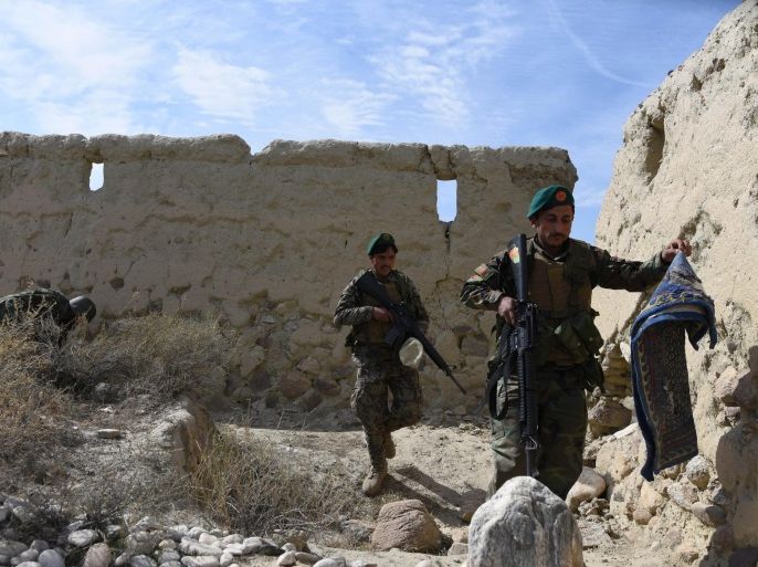 Members of the Afghan security services patrol following an operation against Islamic State militants (IS) in Achin distrct of Nangarhar province, Afghanistan, 17 Febraury 2016. At least 46 Islamic State militants died and 20 others were wounded in an ongoing operation in the Achin district of Afghanistan's eastern Nangarhar province, a police official said on 17 February.