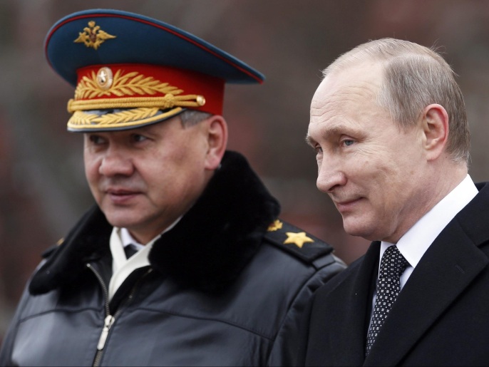 Russian President Vladimir Putin (R) and Russian Defense Minister Sergey Shoygu (L) attend a wreath-laying ceremony at the tomb of the unknown soldier, near the Kremlin during the national celebrations of the 'Defender of the Fatherland Day' in Moscow, Russia, 23 February 2016. Defender of the Fatherland Day is observed in most of Russia and former Soviet republics to commemorate the people serving in the Russian Armed Forces.