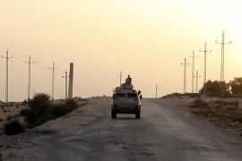 An Egyptian military vehicle is seen on the highway in northern Sinai, Egypt, in this May 25, 2015 file photo. To match Insight EGYPT-SINAI/INSURGENCY REUTERS/Asmaa Waguih/Files