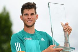 Dominic Thiem of Austria poses with the trophy after winning the final against Philipp Kohlschreiber of Germany during the ATP tournament in Stuttgart, Germany, 13 June 2016.