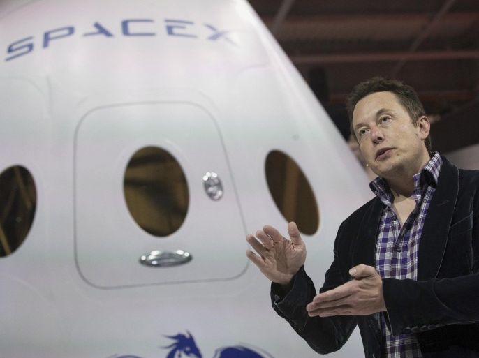 SpaceX CEO Elon Musk speaks after unveiling the Dragon V2 spacecraft in Hawthorne, California May 29, 2014. Space Exploration Technologies announced April 27, 2016, it will send uncrewed Dragon spacecraft to Mars as early as 2018, a first step in company founder Elon Musk's goal to fly people to another planet. REUTERS/Mario Anzuoni/File Photo TPX IMAGES OF THE DAY