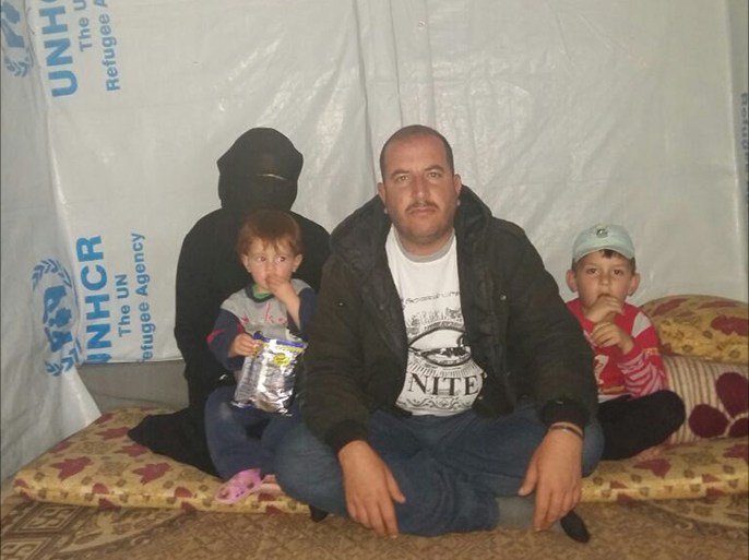 محمد المرعي لاجئ سوري في لبنان مع عائلته.
