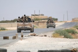 Syria Democratic Forces (SDF) ride vehicles along a road near Manbij, in Aleppo Governorate, Syria, June 25, 2016. REUTERS/Rodi Said