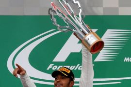 Formula One - Canadian Grand Prix - Montreal, Quebec, Canada - 12/6/16 - Mercedes F1 driver Lewis Hamilton of Britain celebrates winning the race. REUTERS/Chris Wattie