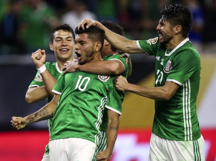 Jun 13, 2016; Houston, TX, USA; Mexico forward Jesus Manuel Corona (10) celebrates with teammates after scoring a goal during the second half against Venezuela during the group play stage of the 2016 Copa America Centenario at NRG Stadium. Venezuela and Mexico tied 1-1. Mandatory Credit: Troy Taormina-USA TODAY Sports