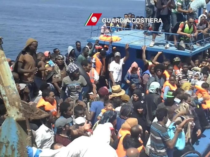 A handout image released by Italian Guard Coast on 23 August 2015 of migrants overcrowding a boat off the Italian coast in the Mediterranean Sea, 22 August 2015. At least 4,000 migrants are being rescued in several large-scale operations in the central Mediterranean, Italian authorities said 22 August 2015. The Italian navy and customs police, as well as a Norwegian vessel part of the Triton border patrol mission, which is coordinated by the European Union, were said to