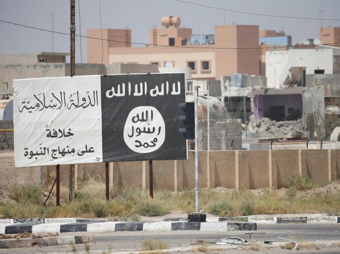 Flag of the Islamic State militants is seen in Falluja, Iraq, June 25, 2016. REUTERS/Thaier Al-Sudani