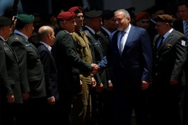Israel's new Defence Minister, Avigdor Lieberman, head of far-right Yisrael Beitenu party, shakes hands Israeli army generals during a welcoming ceremony at the Defence Ministry in Tel Aviv, Israel May 31, 2016. REUTERS/Ronen Zvulun