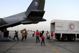 Humanitarian aid supplies are unloaded from a Czech military airplane into a Syrian Arab Red Crescent truck, after it landed in Damascus airport, Syria June 5, 2016. REUTERS/Omar Sanadiki